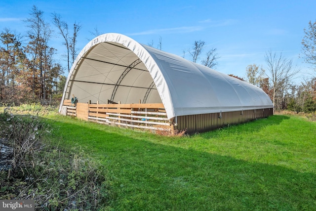 view of outdoor structure featuring a yard