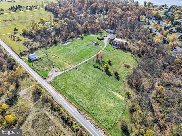 birds eye view of property with a rural view