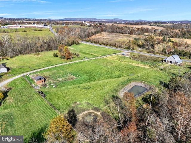 birds eye view of property featuring a rural view