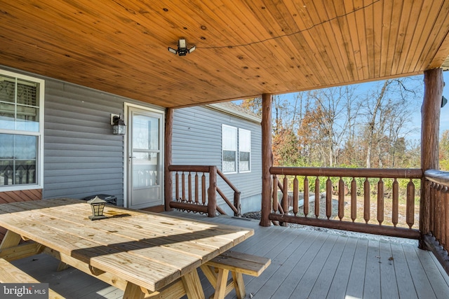 wooden terrace featuring outdoor dining space