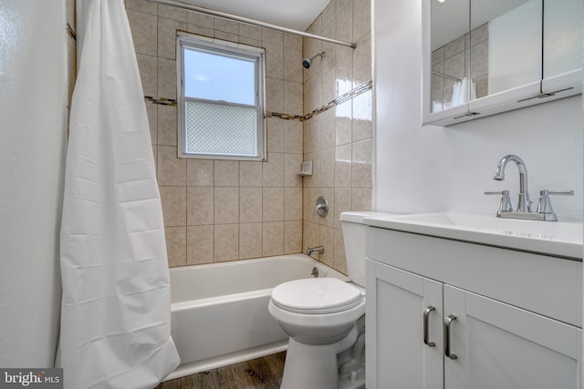 full bathroom featuring shower / tub combo with curtain, vanity, toilet, and hardwood / wood-style flooring