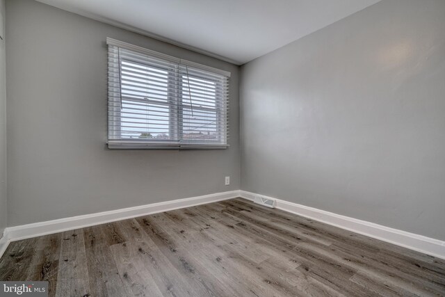 unfurnished room featuring light hardwood / wood-style flooring