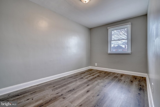 spare room with light wood-type flooring