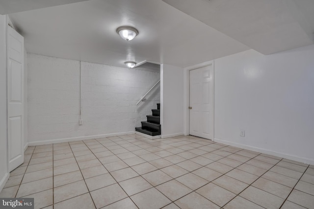 basement with light tile patterned flooring