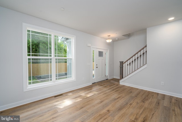 foyer featuring wood-type flooring