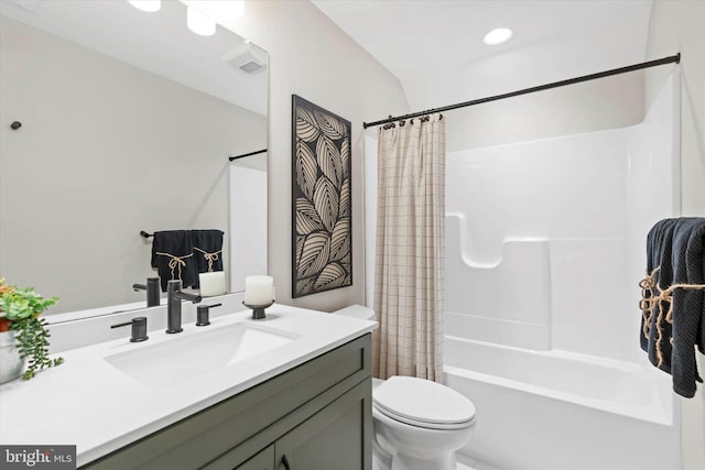 full bathroom with vanity, shower / bath combination with curtain, and toilet