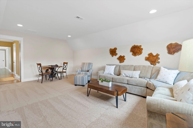 living room with light carpet and lofted ceiling