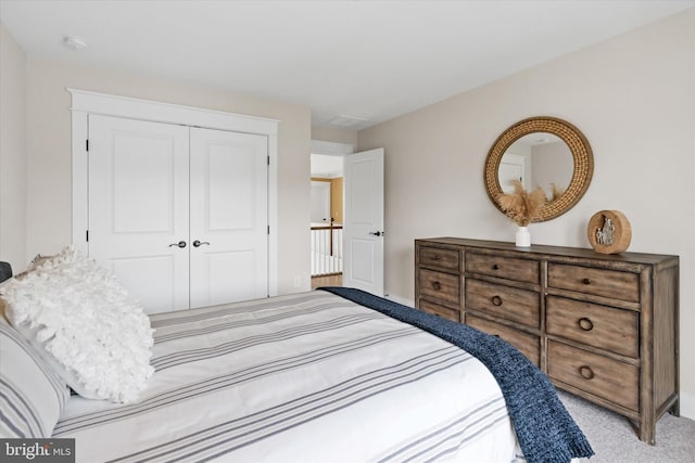 carpeted bedroom featuring a closet