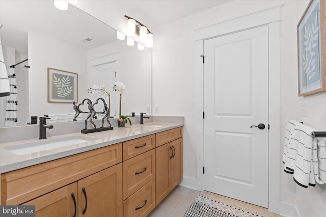 bathroom featuring vanity, curtained shower, and tile patterned floors