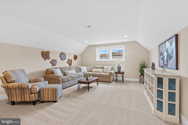 living room with light carpet and vaulted ceiling