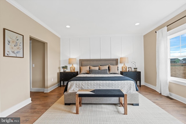 bedroom with ornamental molding and wood-type flooring