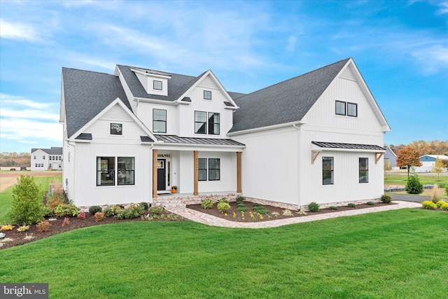 modern farmhouse with a front lawn