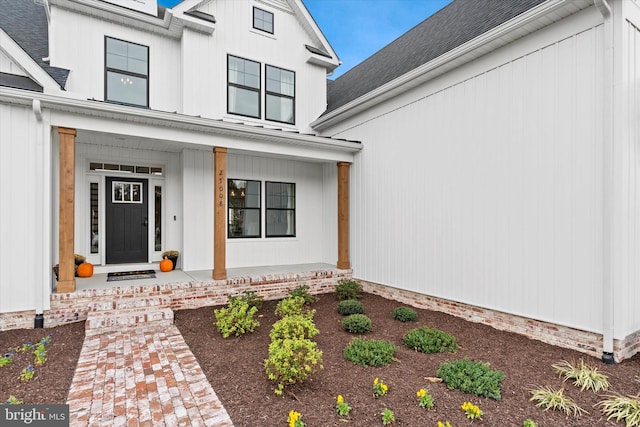 doorway to property featuring covered porch