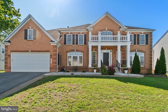 view of front of home with a garage and a front lawn