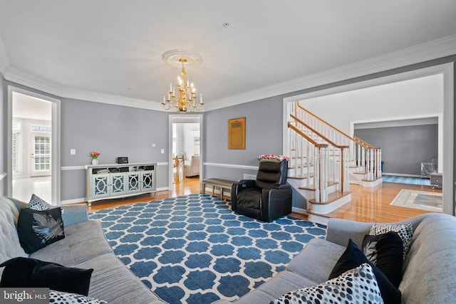 living room featuring hardwood / wood-style flooring and crown molding