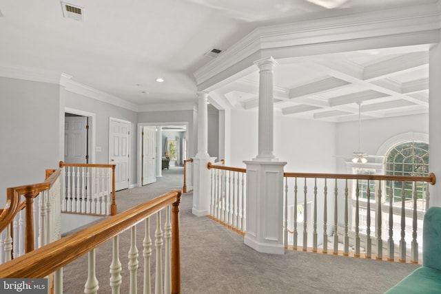 corridor featuring beamed ceiling, coffered ceiling, light carpet, and crown molding