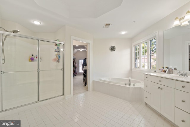 bathroom with separate shower and tub, vanity, and tile patterned floors