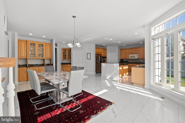 dining space with a notable chandelier