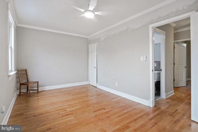 unfurnished room featuring light hardwood / wood-style flooring, ceiling fan, and ornamental molding