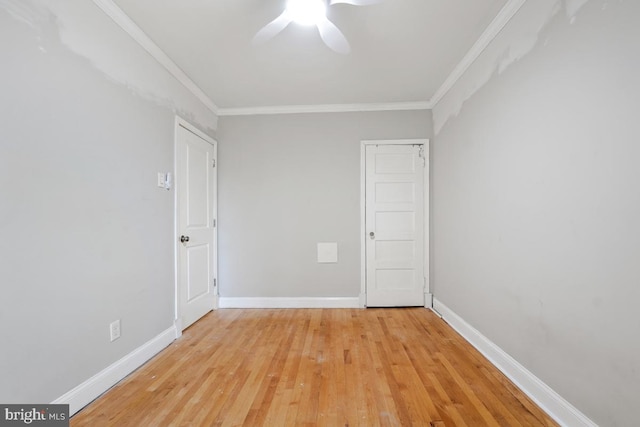 unfurnished room featuring ceiling fan, ornamental molding, and light wood-type flooring