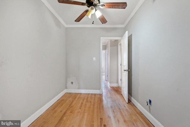 empty room with ceiling fan, ornamental molding, and light hardwood / wood-style flooring