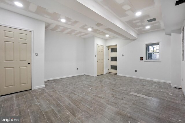 basement featuring wood-type flooring