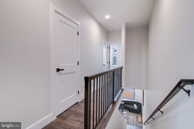 stairs featuring hardwood / wood-style flooring