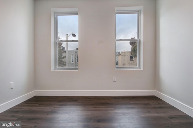 unfurnished room featuring dark hardwood / wood-style floors