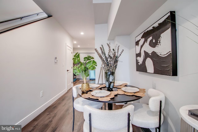 dining space with dark wood-type flooring