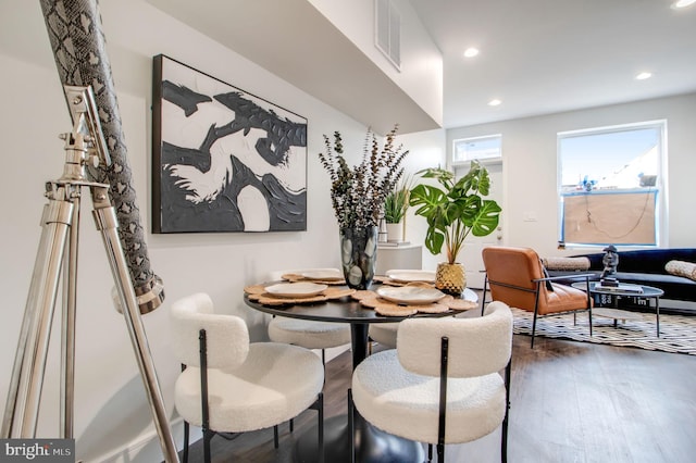 dining space with dark hardwood / wood-style floors