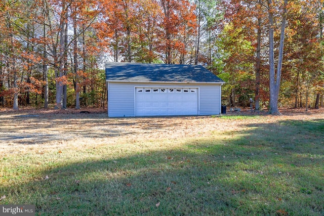 garage featuring a lawn