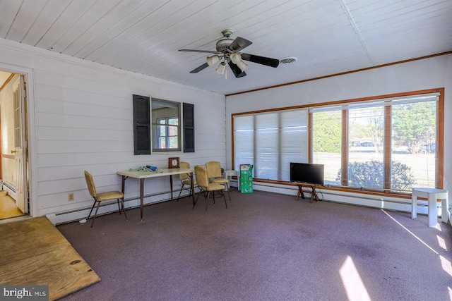 sunroom / solarium featuring a baseboard radiator and ceiling fan