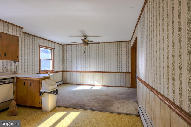 kitchen featuring dishwashing machine, light carpet, ceiling fan, and crown molding