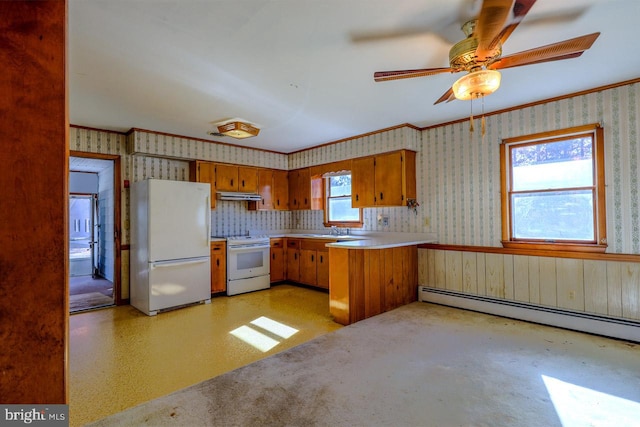 kitchen with kitchen peninsula, a wealth of natural light, a baseboard radiator, and white appliances