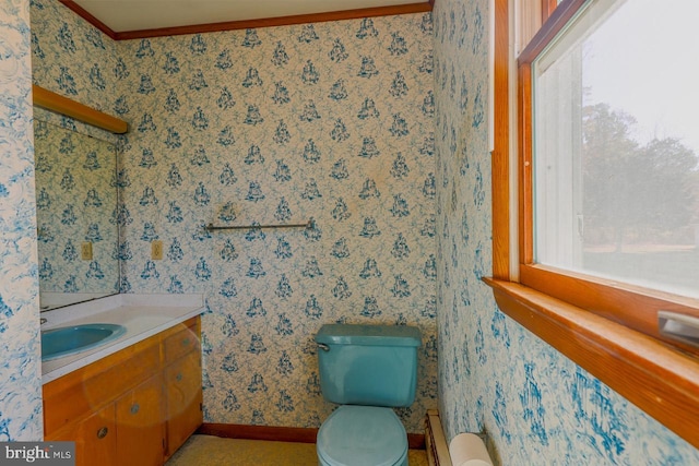 bathroom featuring vanity, toilet, and ornamental molding