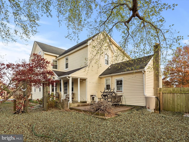 back of property featuring a deck