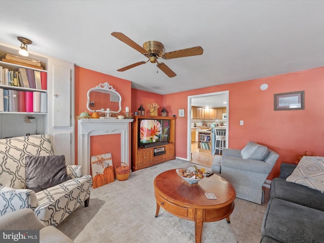 living room featuring ceiling fan and light colored carpet