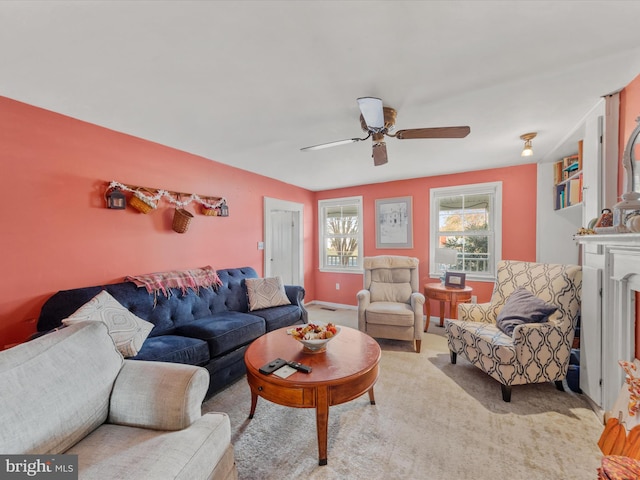 living room with ceiling fan and light carpet