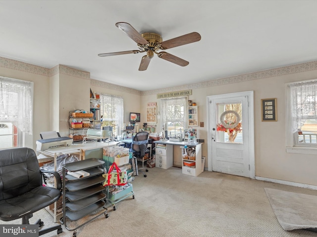 office featuring plenty of natural light, light carpet, and ceiling fan