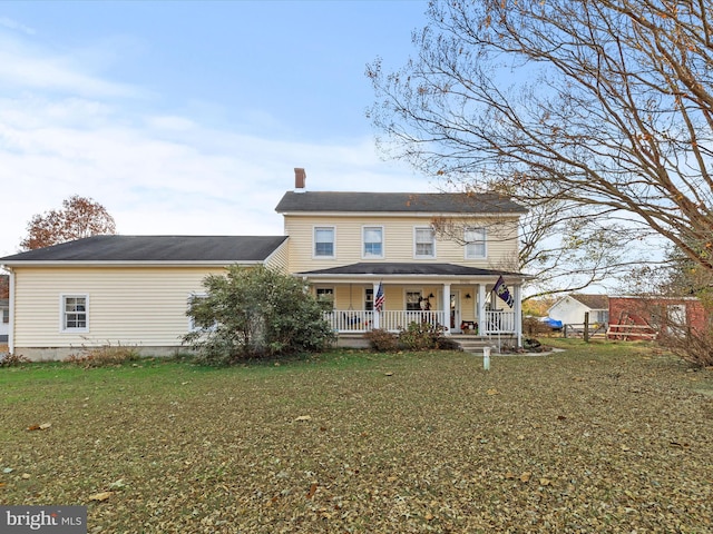 view of front of home featuring a porch and a front yard