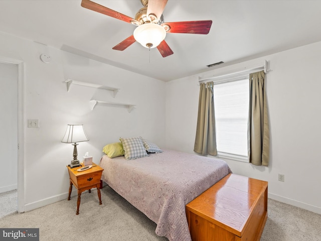 bedroom featuring ceiling fan and light colored carpet