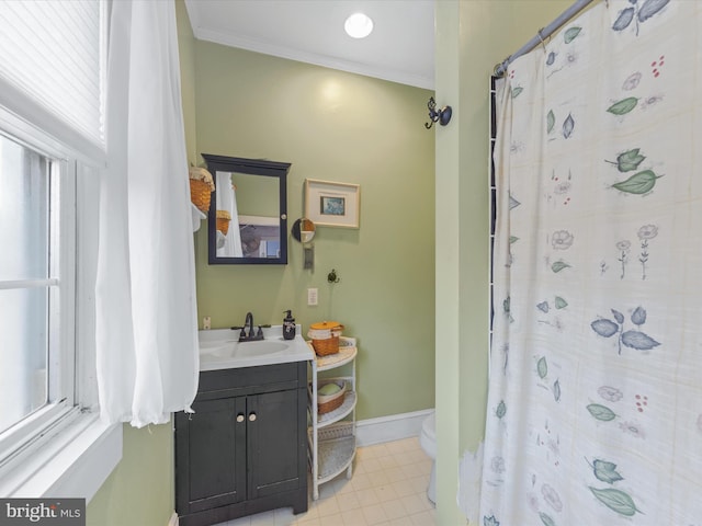 bathroom featuring toilet, tile patterned floors, ornamental molding, vanity, and walk in shower