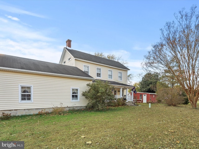 back of house with a yard