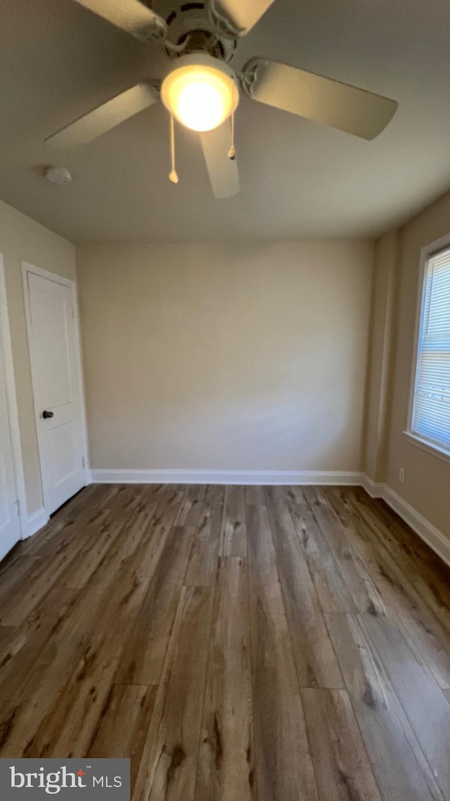 unfurnished room featuring hardwood / wood-style floors and ceiling fan