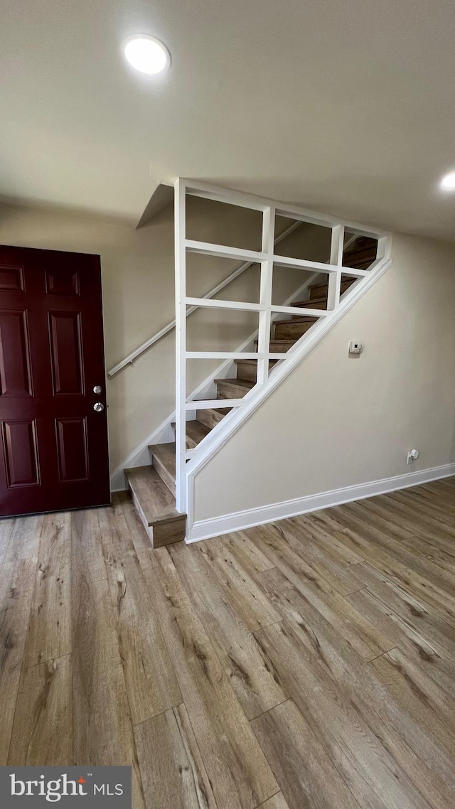 foyer entrance with hardwood / wood-style floors