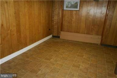 basement with wood walls