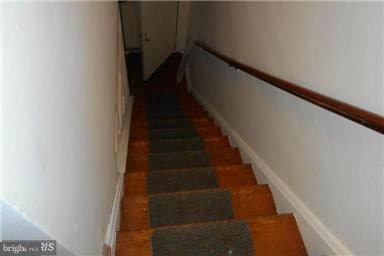 stairway with wood-type flooring