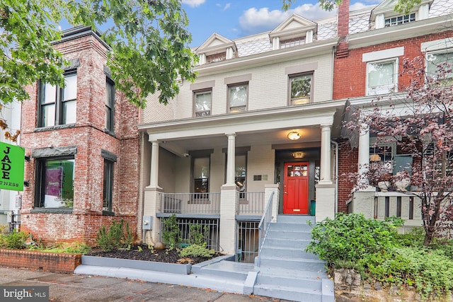1312 Pennsylvania Ave SE, Washington, DC 20003 - multi unit property featuring mansard roof, brick siding, and covered porch