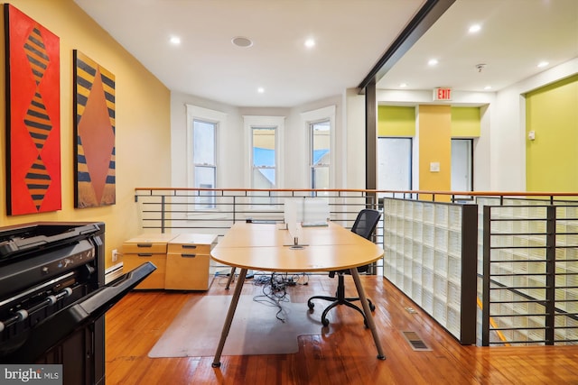 home office with light hardwood / wood-style floors