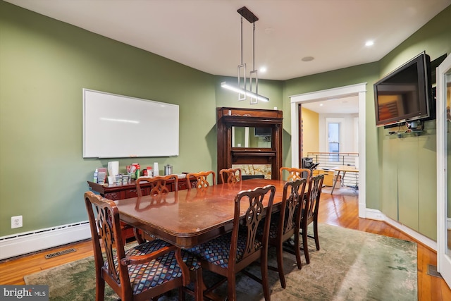 dining space featuring hardwood / wood-style floors